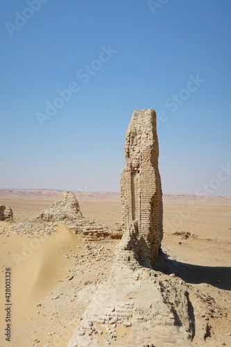 The walls and ruins of Dimeh el Sibaa (Soknopaiou Nesos) in Fayoum city desert in Egypt photo