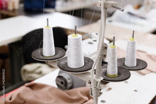 threads with an overlock machine at work photo