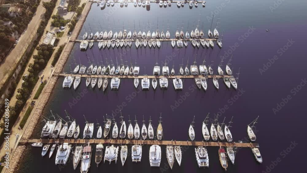Aerial view of the yacht club. Aerial top-down view of docked sailboats. Top down view of yachts Aerial view of the yacht club. Aerial top-down view of docked sailboats. Top down view of yachts