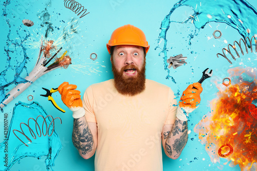 Fotografia Incompetent worker electrician is unsure about his work