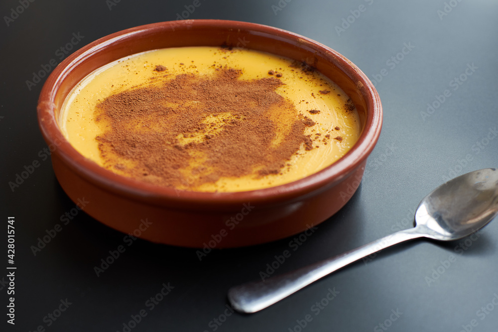View of homemade custard on a black background. View of homemade custard on a black background.
