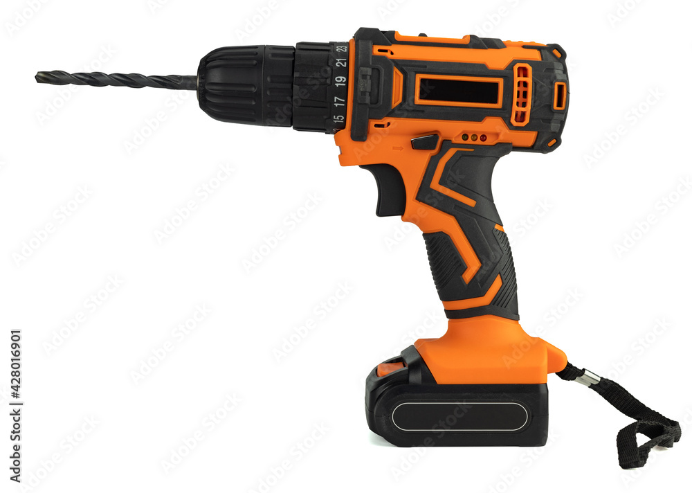 Electric drill with a drill bit. A screwdriver on the battery. Isolated on a white background, close-up.