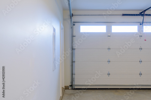 Wallpaper Mural An empty garage with door and windows. Torontodigital.ca