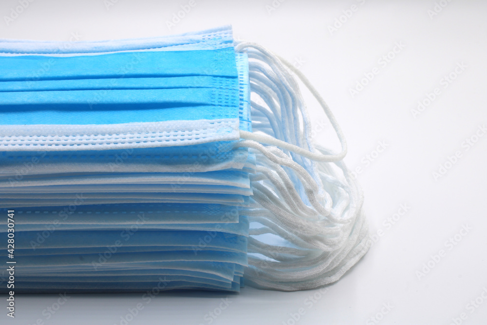 Surgical masks piled up isolated on a white background Surgical masks piled up isolated on a white background