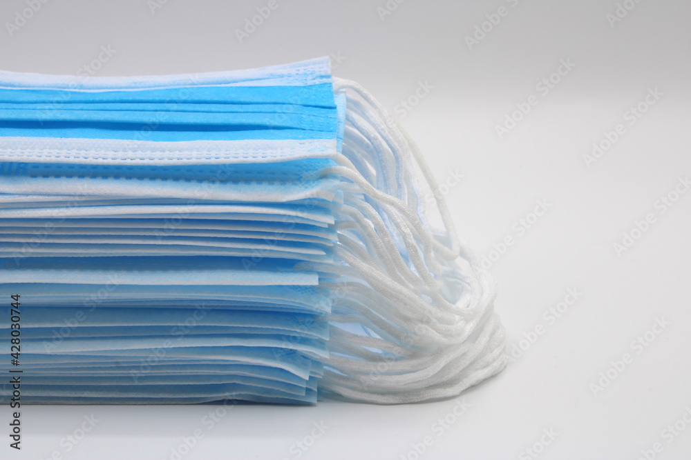 Surgical masks piled up isolated on a white background Surgical masks piled up isolated on a white background