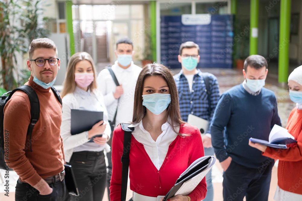 students group at university walking and wearing face mask