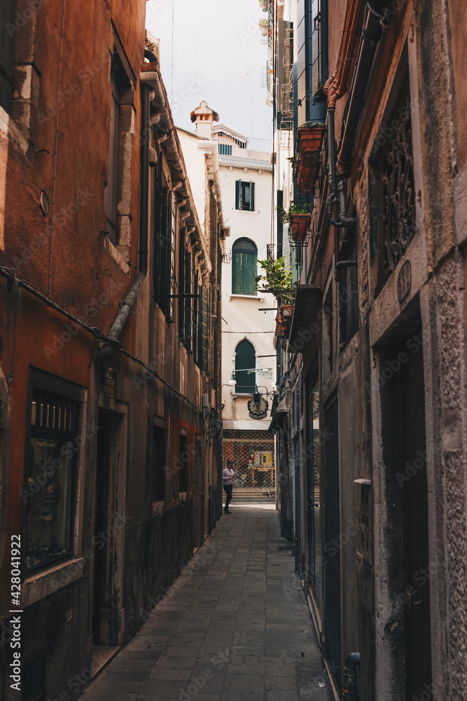 The italian street with beautiful buildings. Film effect and author processing of photo.