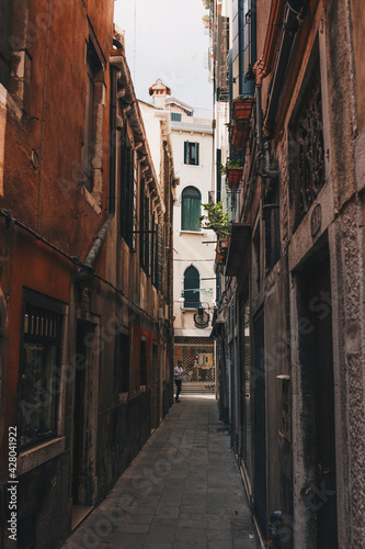 The italian street with beautiful buildings. Film effect and author processing of photo.