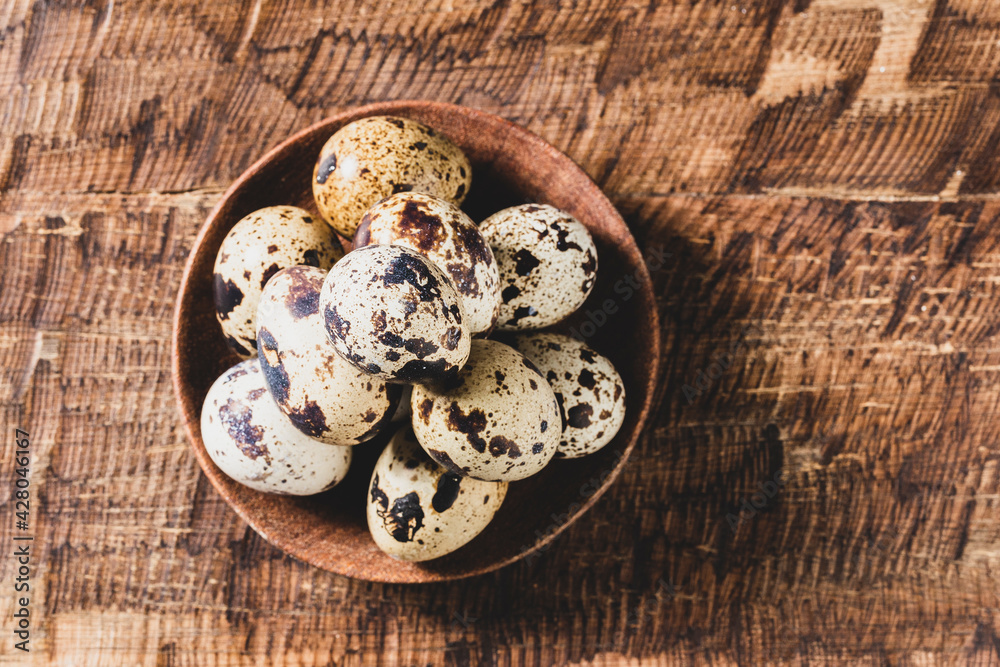 Quail eggs, on the wooden table, close-up image Quail eggs, on the wooden table, close-up image