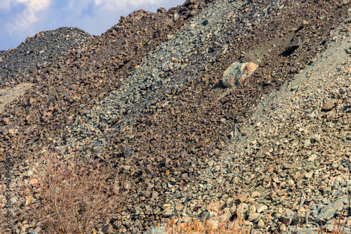 Fotografie View of slag heaps of iron ore quarry. Mining industry