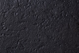 textured black background, close-up image