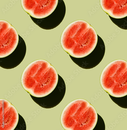 Fresh Watermelon half cut on green background Pattern