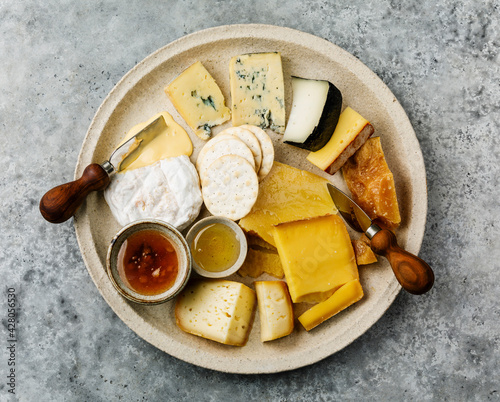 Cheese Plate with different types of cheese Snack assortment on plate photo