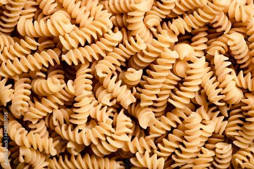 Macro shot of dried fusilli pasta.