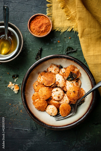 Breakfast  Mini-Idli served with ghee and powder. photo