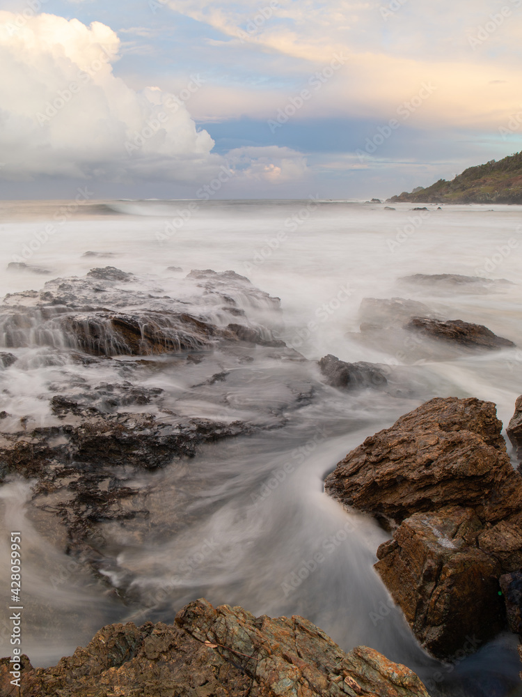 Water flowing between rock formation.