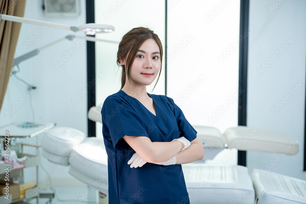 Portrait of beautiful female doctor standing in beauty salon plastic surgery clinic,Health care and beauty concept. Portrait of beautiful female doctor standing in beauty salon plastic surgery clinic,Health care and beauty concept.