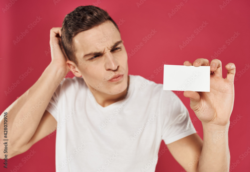Man gesturing with his hands over red background with business card mockup Man gesturing with his hands over red background with business card mockup