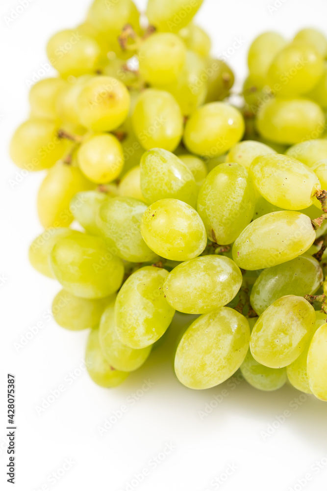 ripe green grapes on a white background. sweet juicy berries. Farm organic products ripe green grapes on a white background. sweet juicy berries. Farm organic products