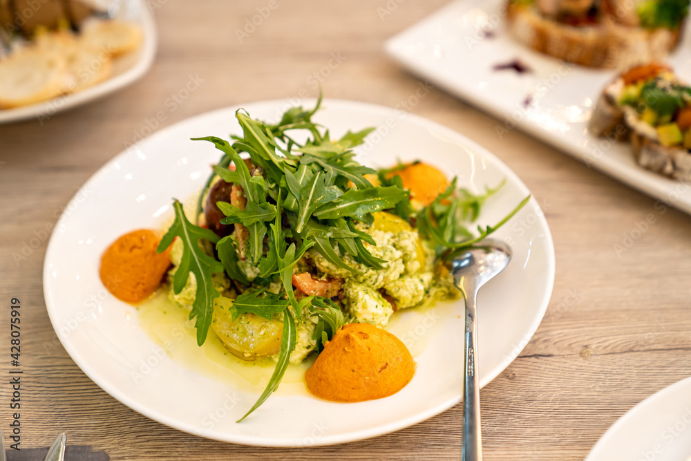 Catering. serving the table salads with arugula for the holiday. ordering ready meals and serving banquets. Catering. serving the table salads with arugula for the holiday. ordering ready meals and serving banquets.