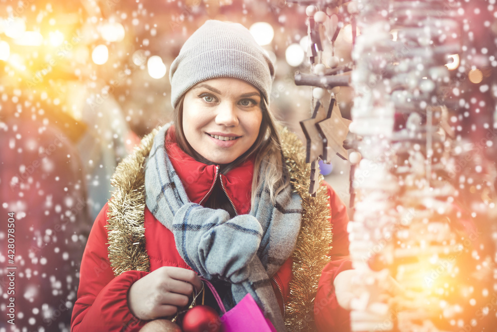 Portrait of young woman smiling happy on Christmas market