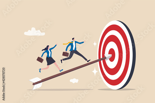 Business achievement, improvement goal, success target or career growth concept, confidence businessman and businesswoman working team running up archer arrow which hitting bullseye target.