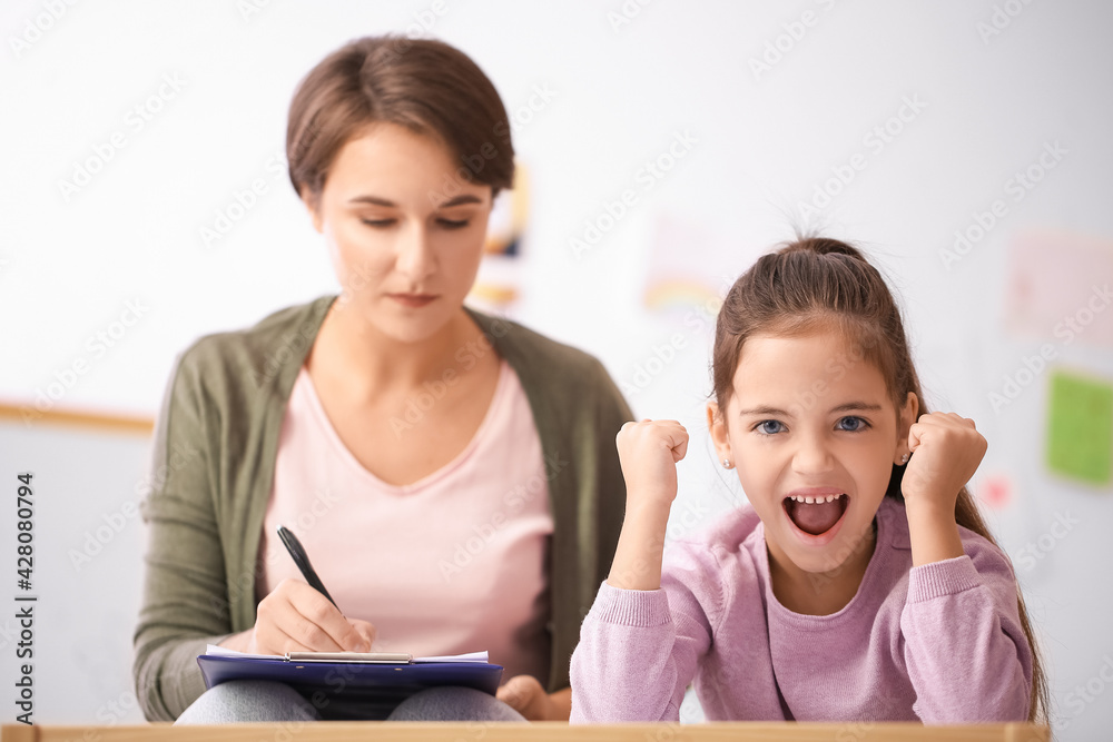 Screaming little girl during psychotherapy session at home Screaming little girl during psychotherapy session at home