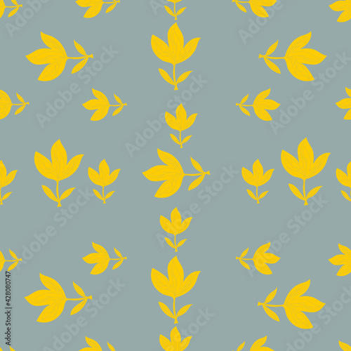 Seamless pattern of yellow abstract flowers, leaves on a gray background. The fashionable color combination of 2021