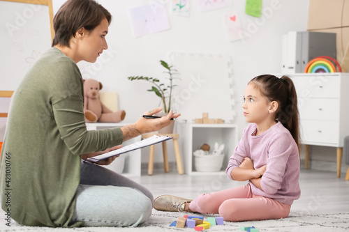 Female psychologist working...