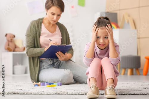 Sad little girl during psyc...