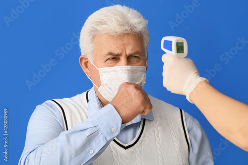 Measuring of sick senior ma...