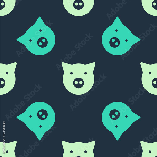 Green and beige Pig icon isolated seamless pattern on blue background. Animal symbol. Vector