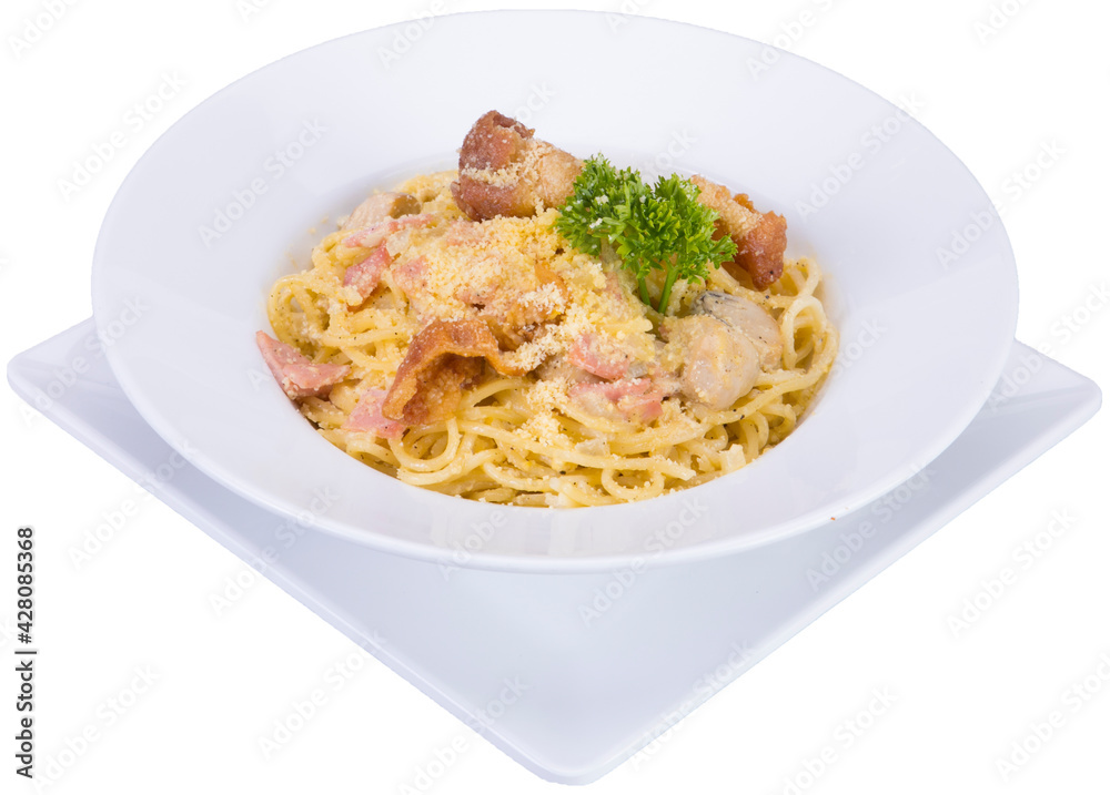 Carbonara pasta. Spaghetti with pancetta, egg, parmesan cheese and cream sauce. Traditional Italian cuisine. Top view. Carbonara pasta. Spaghetti with pancetta, egg, parmesan cheese and cream sauce. Traditional Italian cuisine. Top view.