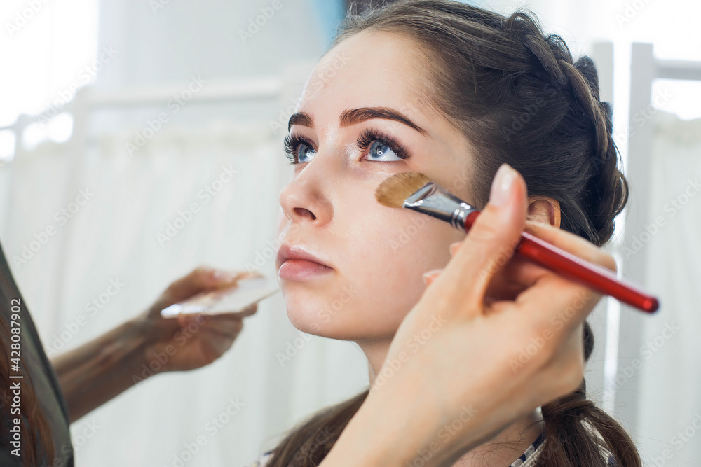 master does a beautiful blonde makeup in a beauty salon master does a beautiful blonde makeup in a beauty salon