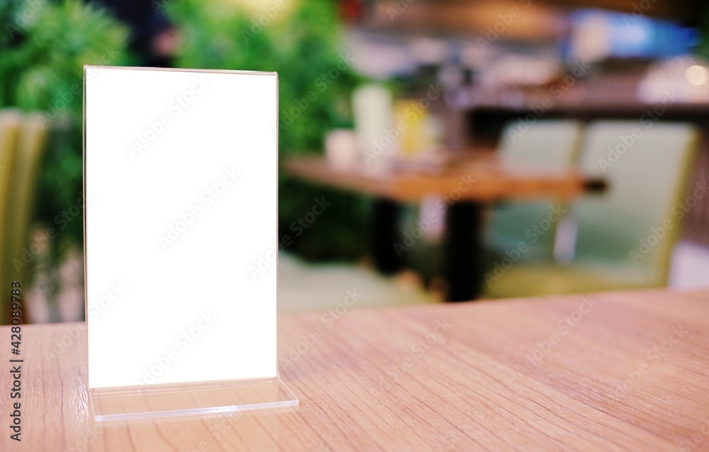 Menu frame standing on wood table in Bar restaurant cafe. space for text marketing promotion. Menu frame standing on wood table in Bar restaurant cafe. space for text marketing promotion.