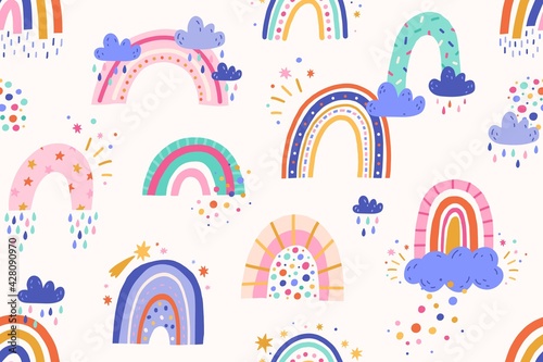 Seamless childish pattern with cute rainbows and rain clouds in doodle style. Endless repeating Scandinavian children background. Colored flat vector illustration of nursery design for printing