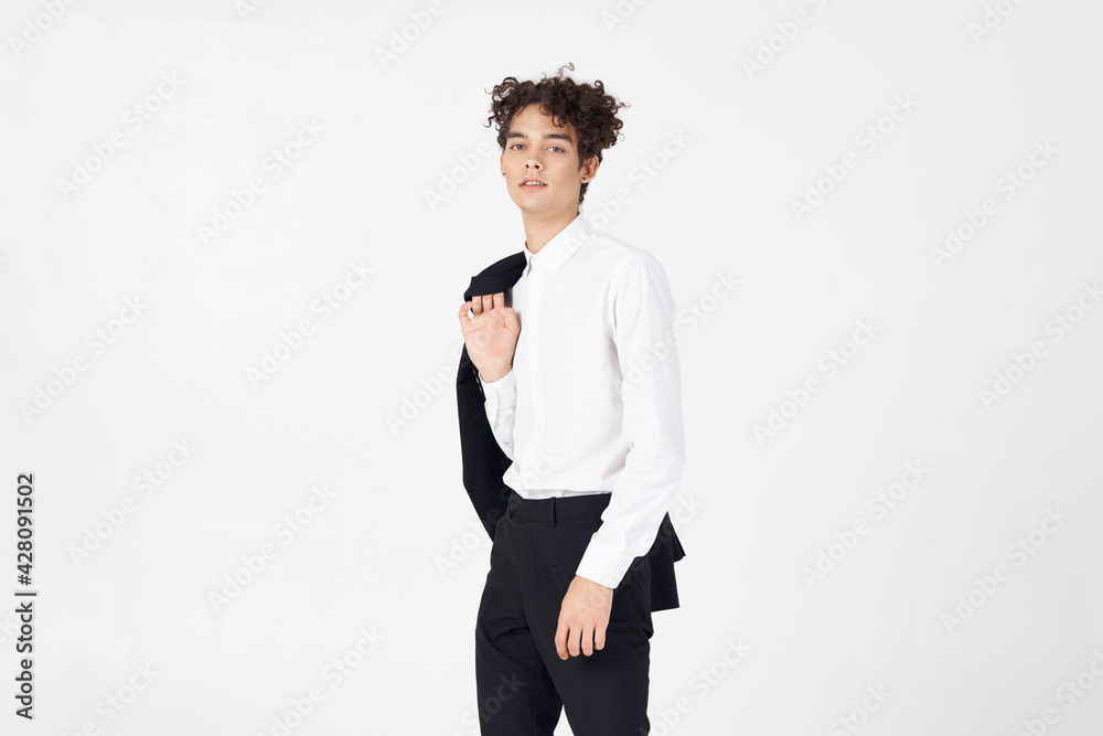 handsome young man in classic suit with jacket in hand on light background cropped view handsome young man in classic suit with jacket in hand on light background cropped view