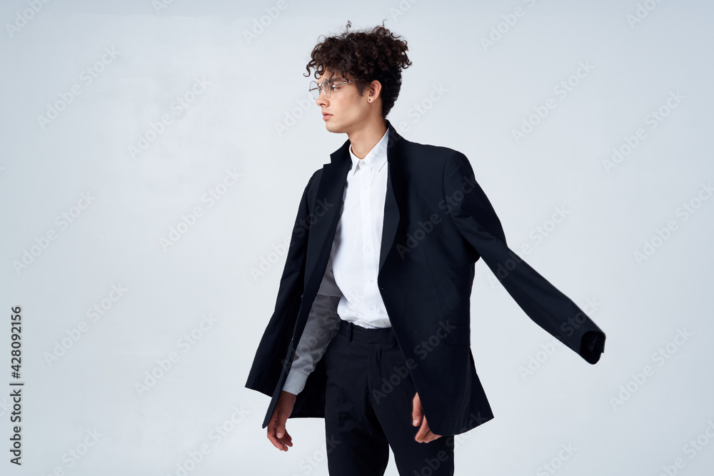 man in black blazer curly hair fashion modern style business suit man in black blazer curly hair fashion modern style business suit