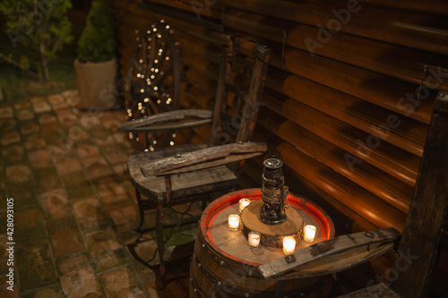 Romantic scene with candlestick on a barrel