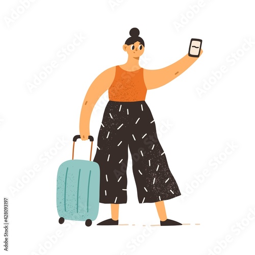 Woman traveling with suitcase and cell phone. Tourist using mobile app on sma...