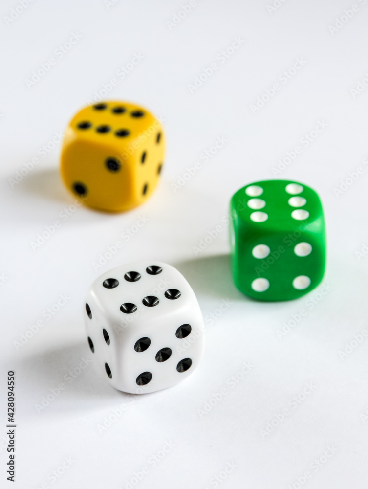Three colorful dices isolated on white background Three colorful dices isolated on white background