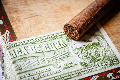Photography Cigars on vintage wooden box with Cuban official tax sticker