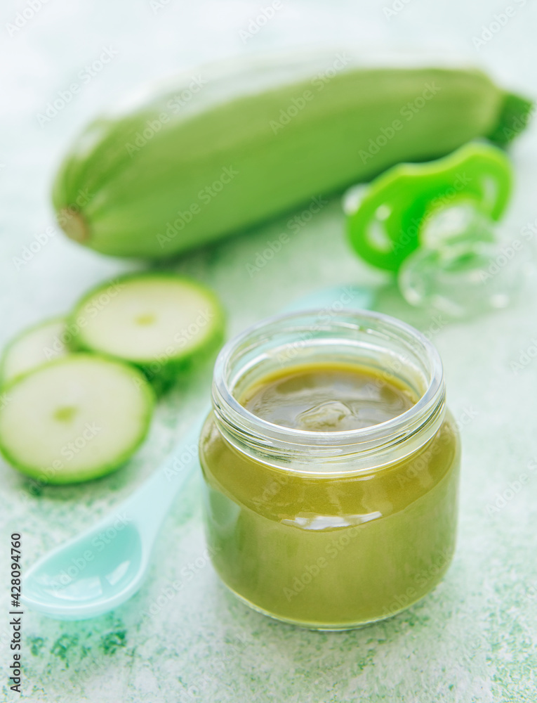 Jar with healthy baby food and zucchini Jar with healthy baby food and zucchini