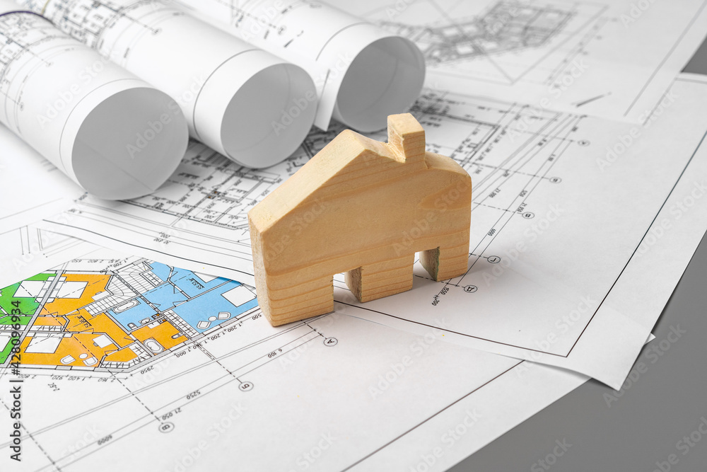 Architectural construction plans paper on table close up Architectural construction plans paper on table close up