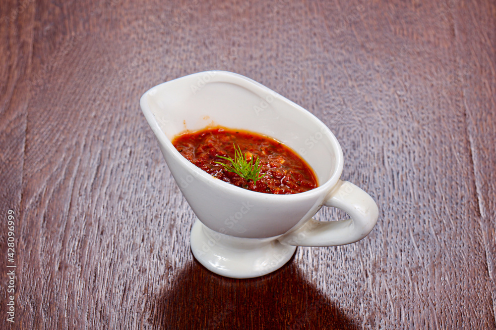 Caucasian traditional Adjika sauce in the bowl Caucasian traditional Adjika sauce in the bowl