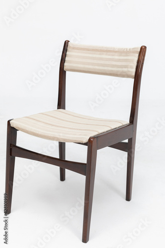 Wooden chair from turn of 70's and 80's from previous century with soft seat and back. Polish design and production. Front view