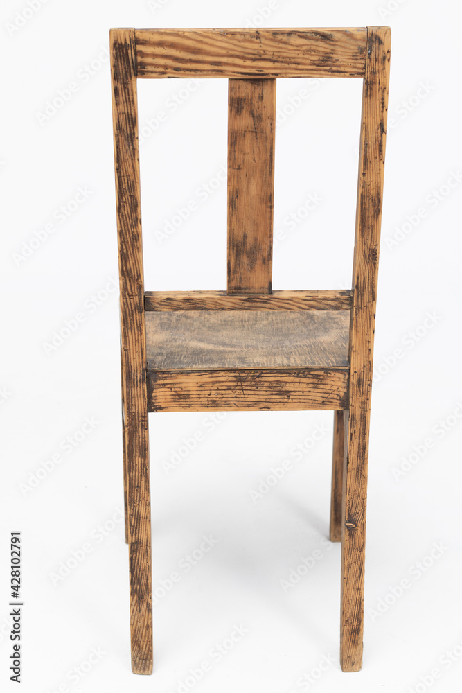 Wooden chair from turn of 70's and 80's from previous century with rustic color. Polish design and production. Rear view Wooden chair from turn of 70's and 80's from previous century with rustic color. Polish design and production. Rear view