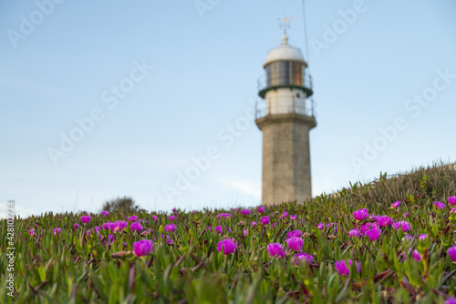 Mesmerizing view of the Larino lighthouse. Galicia, Spain photo