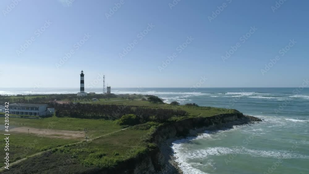 The Chassiron lighthouse at North Oleron Island in Western France, Aerial orbit around side shot The Chassiron lighthouse at North Oleron Island in Western France, Aerial orbit around side shot