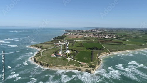 Chassiron lighthouse at the northest point of Oleron Island in Western France, Aerial orbit out shot photo